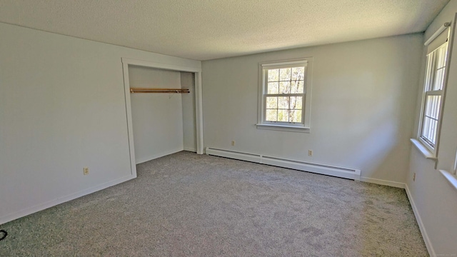 32 Great Hill Pond Rd, Portland, CT 06480 - unfurnished bedroom featuring a textured ceiling, multiple windows, baseboard heating, and carpet
