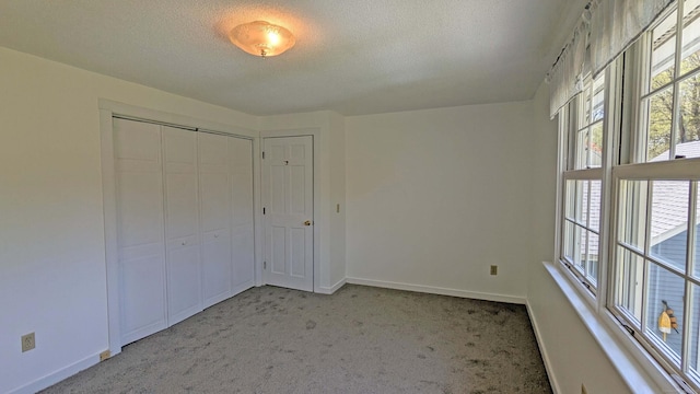 32 Great Hill Pond Rd, Portland, CT 06480 - unfurnished bedroom featuring baseboards, light carpet, a closet, and a textured ceiling