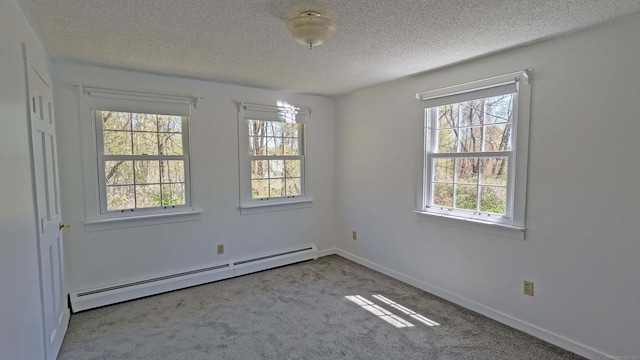 32 Great Hill Pond Rd, Portland, CT 06480 - carpeted empty room featuring baseboards, baseboard heating, and a textured ceiling