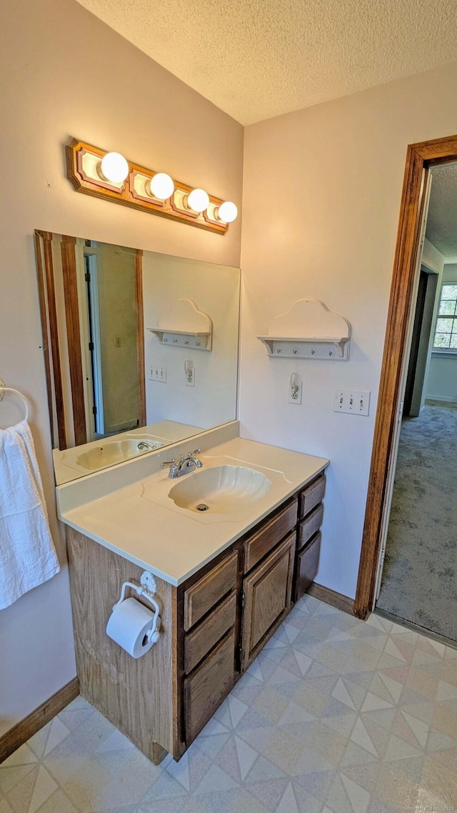 32 Great Hill Pond Rd, Portland, CT 06480 - bathroom with tile patterned floors, baseboards, vanity, and a textured ceiling