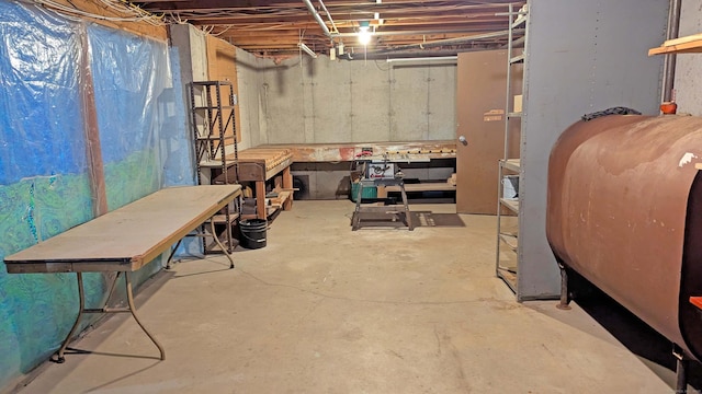 32 Great Hill Pond Rd, Portland, CT 06480 - unfinished below grade area featuring a workshop area and heating fuel