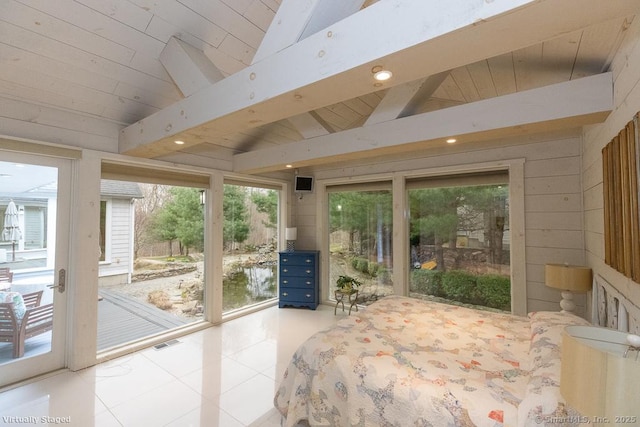 bedroom with access to outside, tile patterned floors, multiple windows, and lofted ceiling