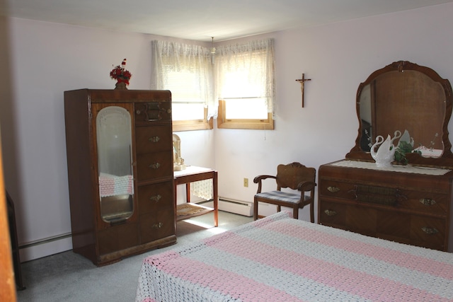 bedroom with a baseboard radiator, carpet, and a baseboard heating unit