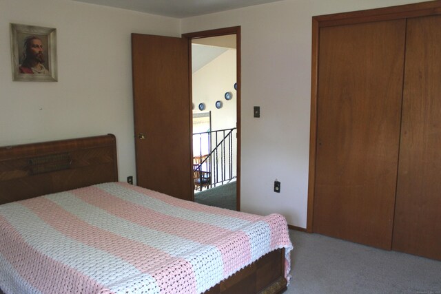 carpeted bedroom with a closet