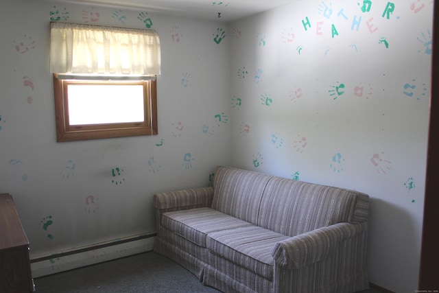 sitting room featuring a baseboard radiator and carpet