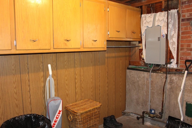interior space featuring wooden walls and electric panel