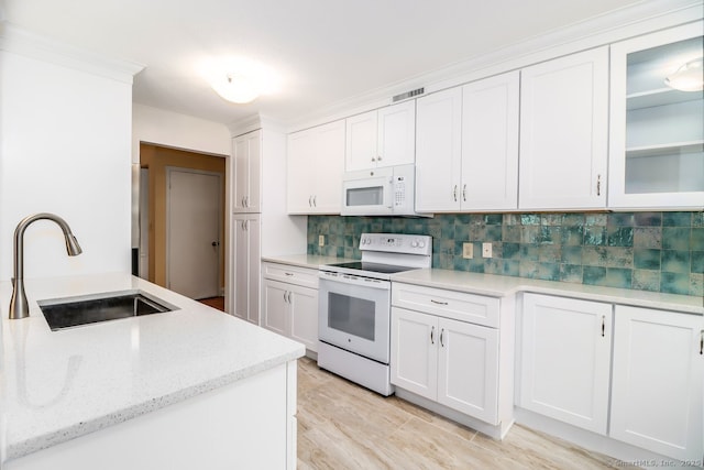 920 Heritage Vlg Unit A, Southbury, CT 06488 - kitchen featuring white appliances, backsplash, white cabinetry, glass insert cabinets, and light stone counters