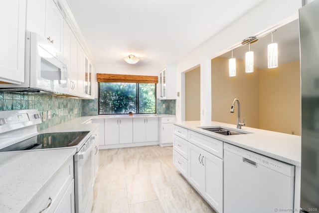 920 Heritage Vlg Unit A, Southbury, CT 06488 - kitchen with white appliances, tasteful backsplash, white cabinetry, glass insert cabinets, and hanging light fixtures