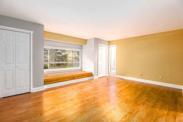 920 Heritage Vlg Unit A, Southbury, CT 06488 - unfurnished living room with wood finished floors