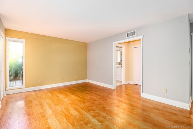920 Heritage Vlg Unit A, Southbury, CT 06488 - unfurnished room with light wood finished floors and baseboards