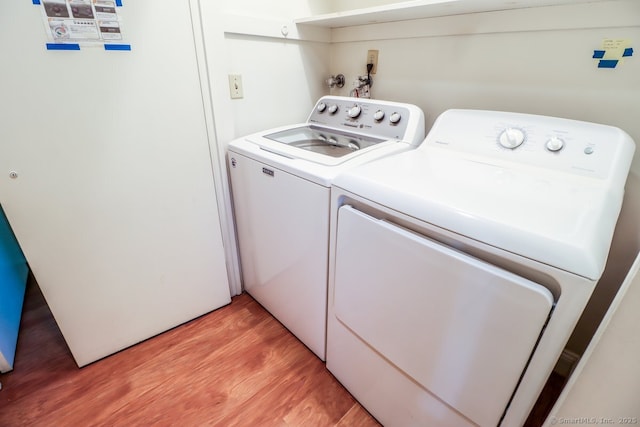 920 Heritage Vlg Unit A, Southbury, CT 06488 - laundry room featuring independent washer and dryer and light wood-type flooring