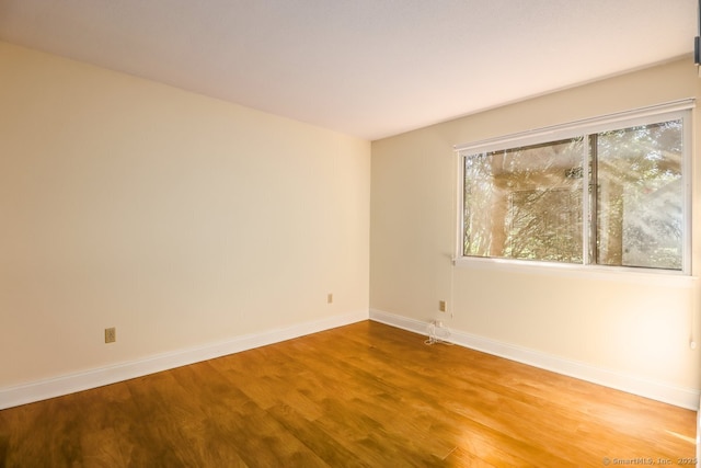 920 Heritage Vlg Unit A, Southbury, CT 06488 - empty room with wood finished floors and baseboards