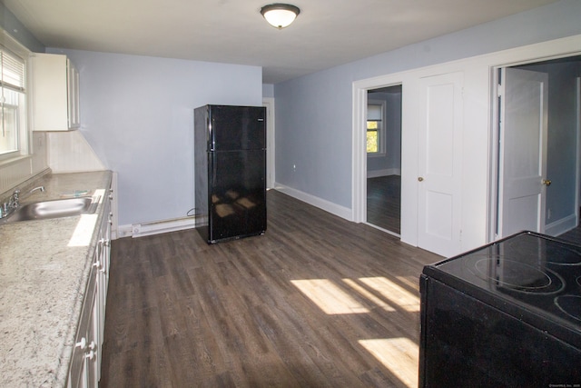 35 Clinton Ave, Middletown, CT 06457 - interior space featuring baseboards, a baseboard heating unit, and dark wood-type flooring