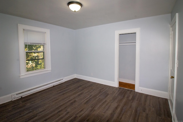 35 Clinton Ave, Middletown, CT 06457 - unfurnished bedroom featuring a closet, baseboards, dark wood-style floors, and a baseboard radiator
