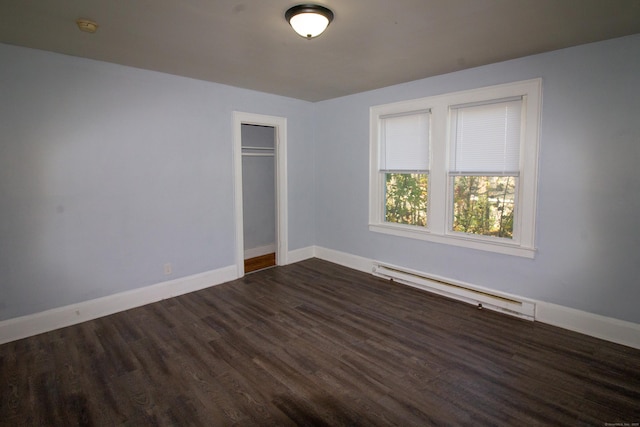 35 Clinton Ave, Middletown, CT 06457 - empty room featuring dark wood-type flooring, baseboards, and a baseboard heating unit