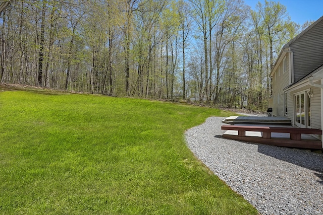 view of yard featuring a wooden deck