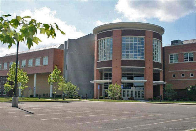 view of property with uncovered parking