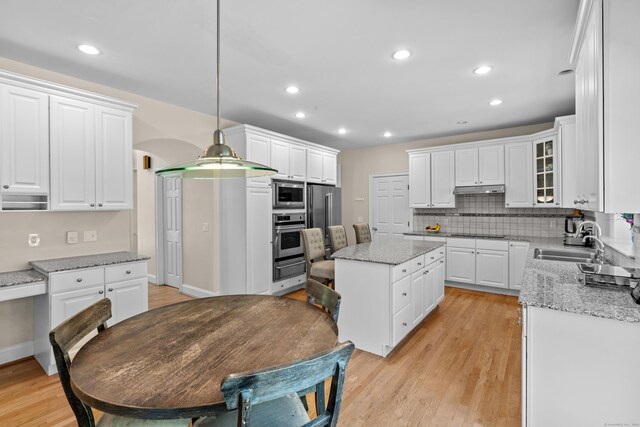 kitchen featuring a sink, white cabinetry, and appliances with stainless steel finishes