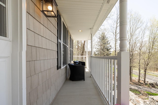 view of property exterior with a porch