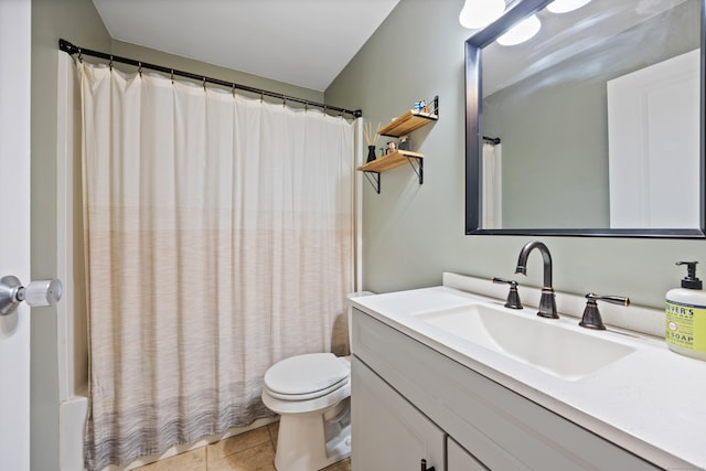 full bathroom with toilet, tile patterned flooring, and vanity