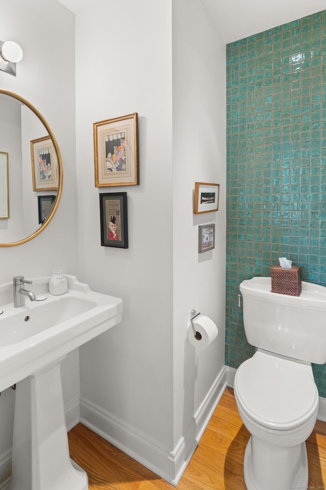 33 Hale Ln Unit 33, Darien, CT 06820 - bathroom with toilet, baseboards, and wood finished floors
