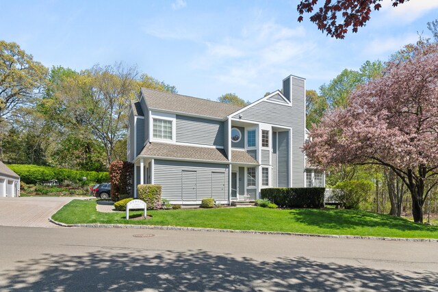 33 Hale Ln Unit 33, Darien, CT 06820 - traditional-style house with roof with shingles, a chimney, a front lawn, and a garage