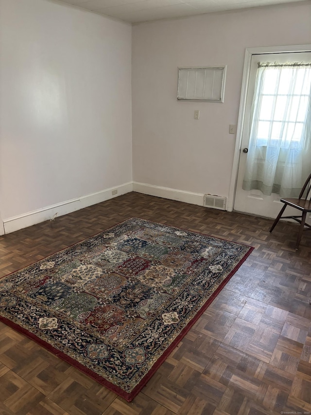 interior space featuring baseboards and visible vents