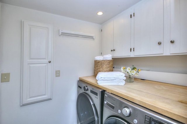 53 Sylvan Rd N, Westport, CT 06880 - laundry area with cabinet space, washer and dryer, a wall mounted air conditioner, and recessed lighting