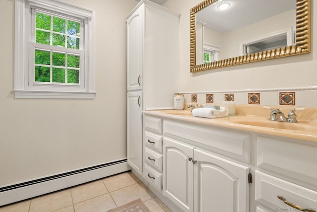bathroom featuring baseboard heating, tile patterned flooring, and vanity
