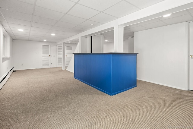 finished below grade area featuring carpet floors, a dry bar, a paneled ceiling, recessed lighting, and baseboards