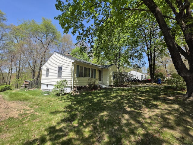 view of home's exterior featuring a yard