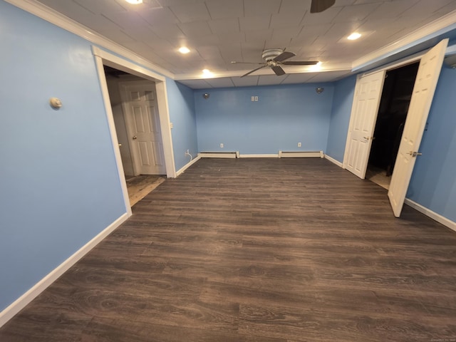 unfurnished bedroom with baseboards, dark wood finished floors, and a baseboard radiator
