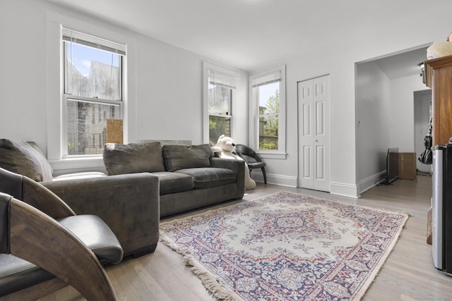living room with light wood-style floors and baseboards