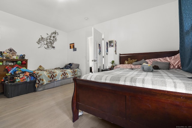bedroom featuring light wood-style floors
