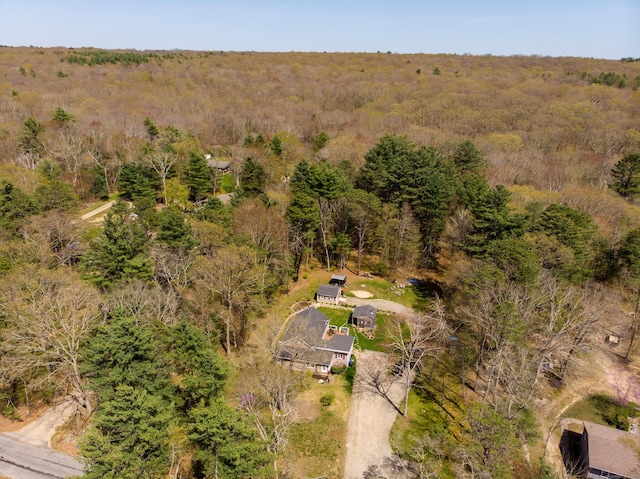 drone / aerial view featuring a forest view