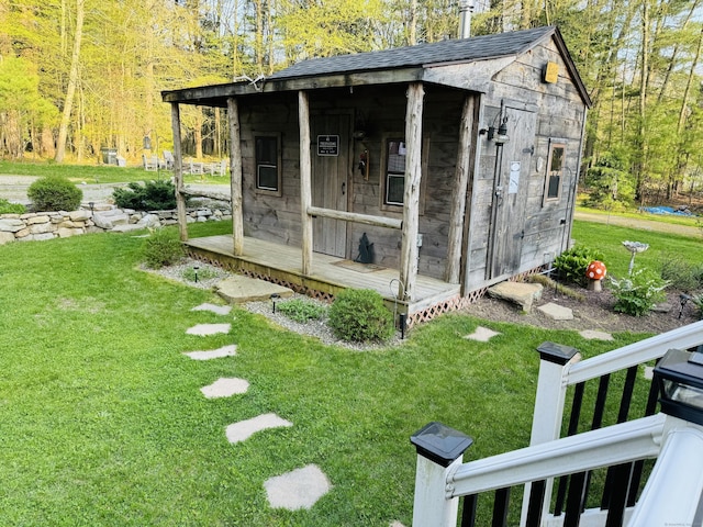 view of outbuilding with an outbuilding and a forest view