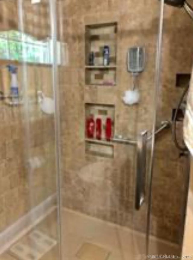bathroom with a stall shower