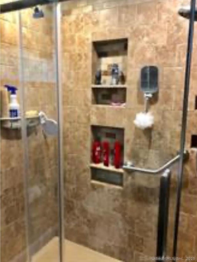 full bathroom with a stall shower