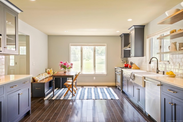 53 Upland Meadow Rd, Salisbury, CT 06068 - kitchen with stainless steel appliances, dark wood finished floors, light countertops, decorative backsplash, and recessed lighting