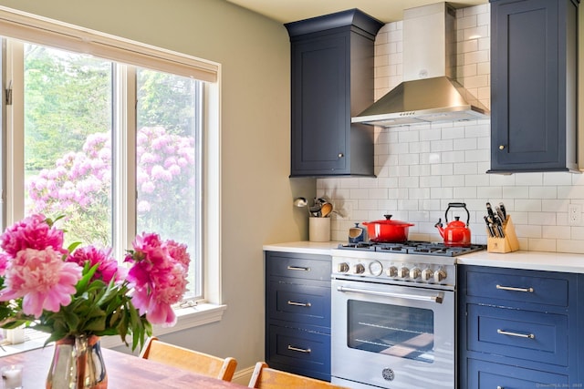 53 Upland Meadow Rd, Salisbury, CT 06068 - kitchen featuring wall chimney exhaust hood, high end stainless steel range, decorative backsplash, and light countertops