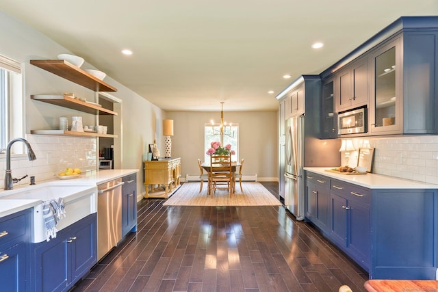 53 Upland Meadow Rd, Salisbury, CT 06068 - kitchen featuring stainless steel appliances, a chandelier, blue cabinets, tasteful backsplash, and recessed lighting