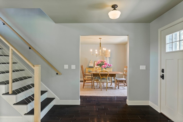 53 Upland Meadow Rd, Salisbury, CT 06068 - entrance foyer featuring dark wood finished floors, a chandelier, and stairs