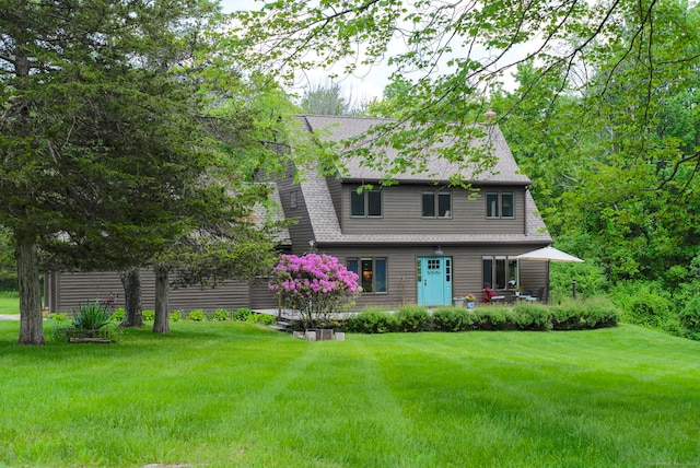 53 Upland Meadow Rd, Salisbury, CT 06068 - view of front of house with a front lawn and roof with shingles