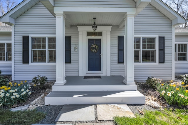 property entrance featuring a porch