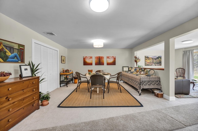 dining space featuring carpet floors and visible vents