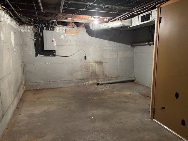 unfinished below grade area with visible vents and electric panel