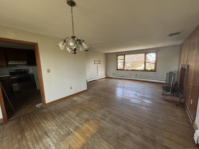 unfurnished living room with an inviting chandelier, baseboards, dark wood-style floors, and visible vents