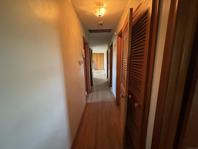 corridor featuring wood finished floors