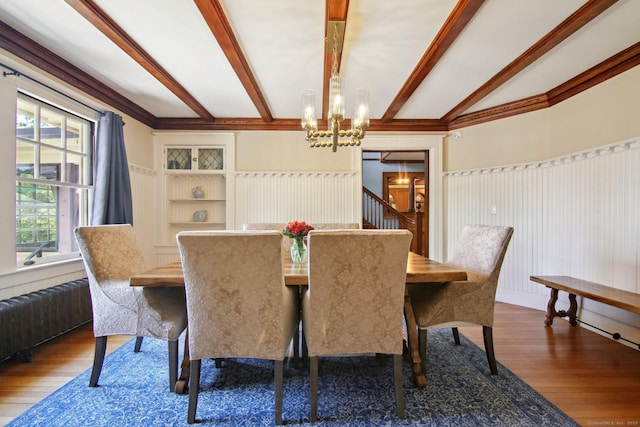 836 Prospect Ave, Hartford, CT 06105 - dining space with a chandelier, beamed ceiling, wood finished floors, radiator heating unit, and stairway