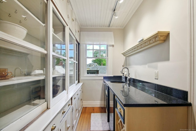 836 Prospect Ave, Hartford, CT 06105 - kitchen with a sink, light wood-style flooring, baseboards, wooden ceiling, and track lighting